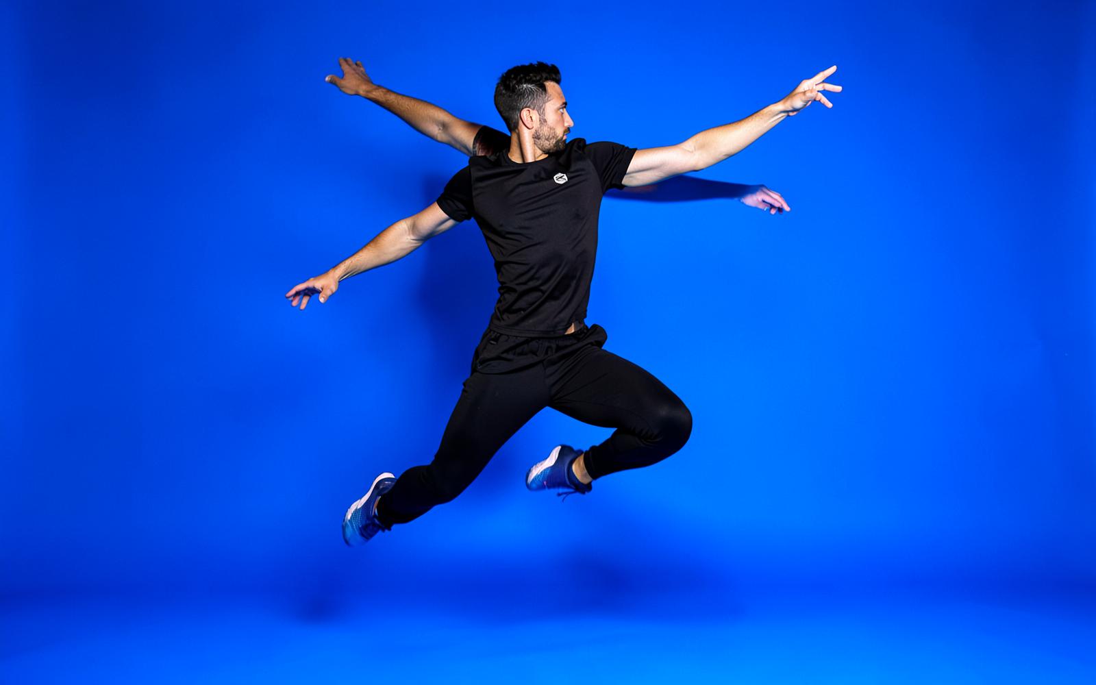 Placeholder athlete campaign photography on an electric blue backdrop